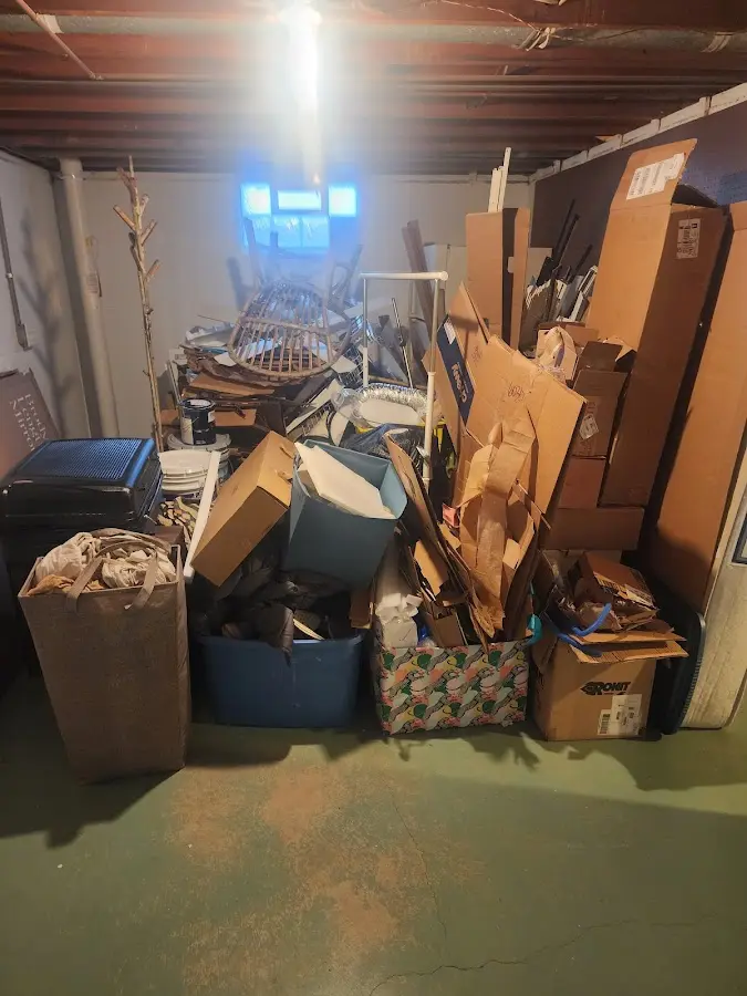 Roll-off dumpster container at job site for Yard Waste Dumpster Rental in Newport